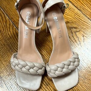 Danna Raye blush color open toe heels. Strap buckles at ankle. Size 7.